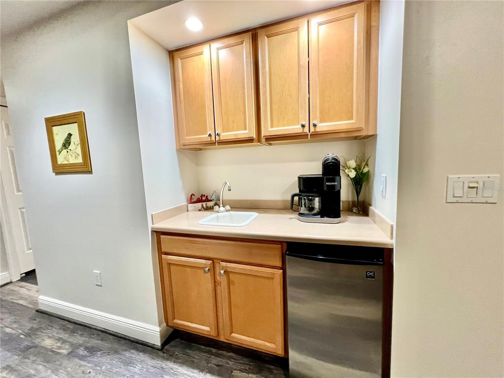 3321 Sunset Key Circle, Unit 102 Punta Gorda, FL 33955 - Photo 21 of 57 a kitchen with a sink cabinets and window