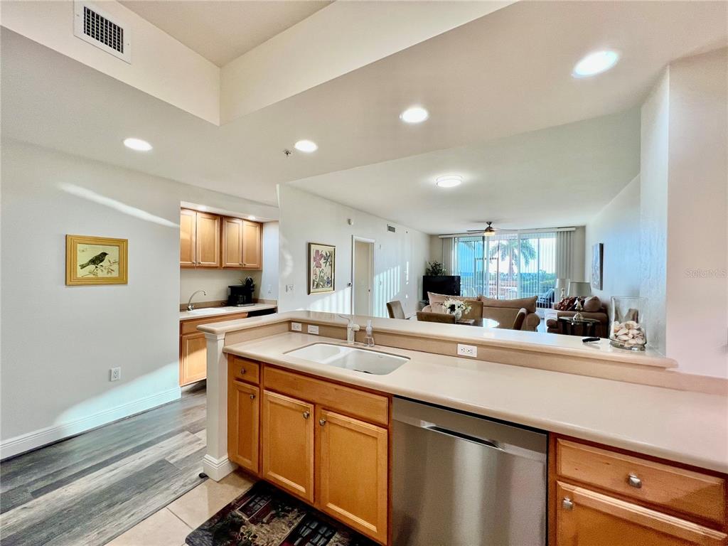3321 Sunset Key Circle, Unit 102 Punta Gorda, FL 33955 - Photo 23 of 57 a kitchen with a sink and a stove top oven