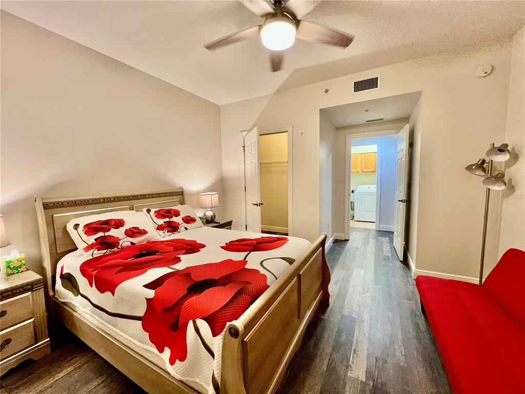 3321 Sunset Key Circle, Unit 102 Punta Gorda, FL 33955 - Photo 32 of 57 a bed room with a bed and a chandelier