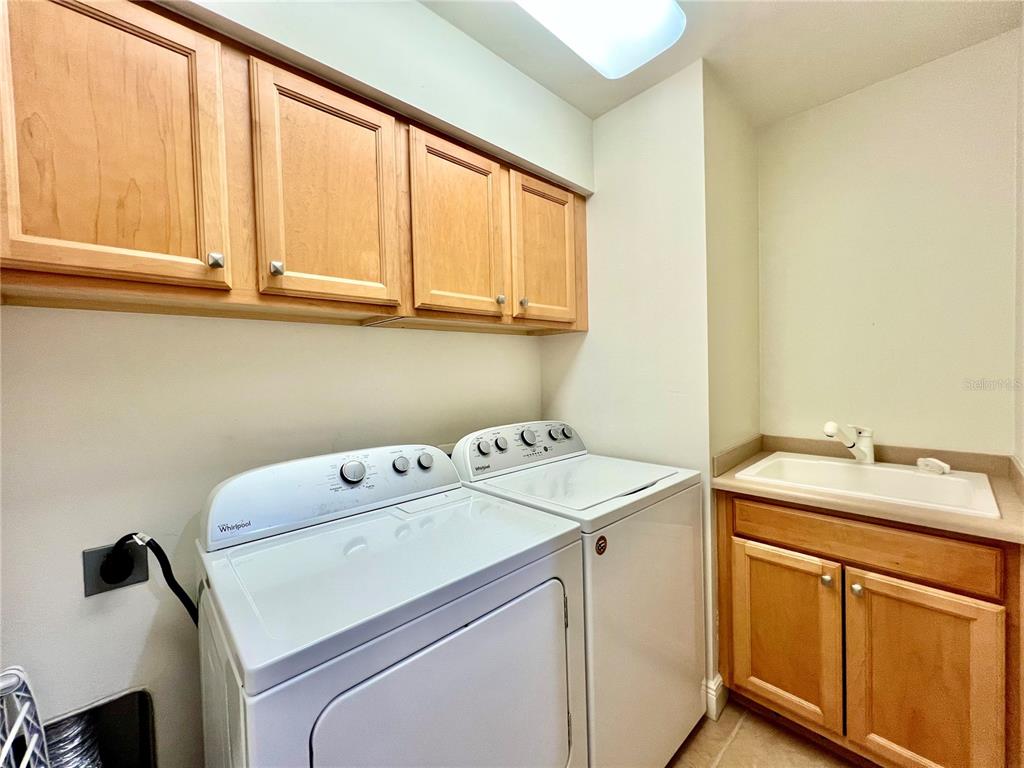 3321 Sunset Key Circle, Unit 102 Punta Gorda, FL 33955 - Photo 38 of 56 a utility room with dryer and washer