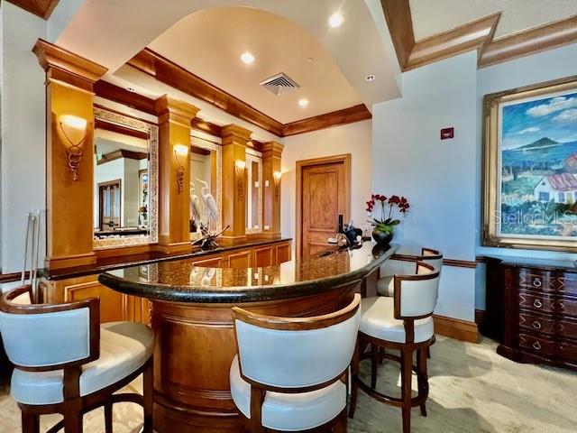 3321 Sunset Key Circle, Unit 102 Punta Gorda, FL 33955 - Photo 50 of 57 a dining room with furniture and wooden floor