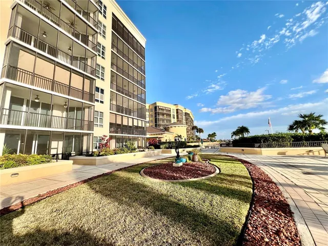 a view of a swimming pool with an outdoor seating