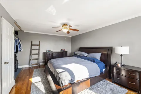 a bedroom with a bed and a lamp