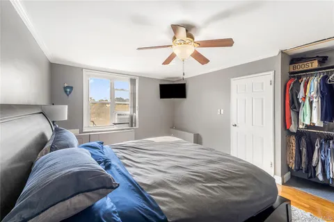 a bedroom with a large bed and a window