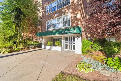 a view of a building with a yard