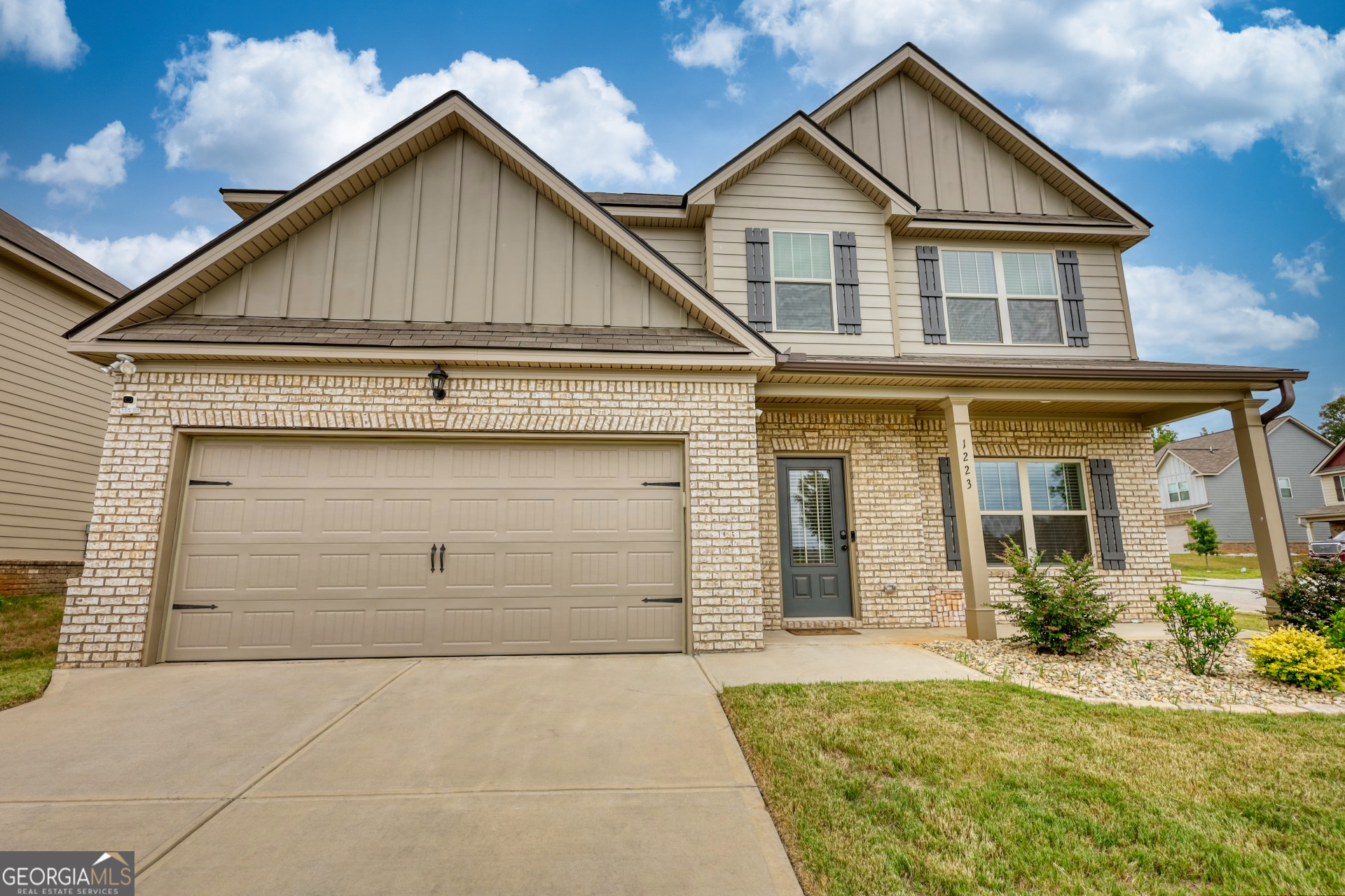 front view of a house with a yard