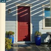 a front view of a house with outdoor seating