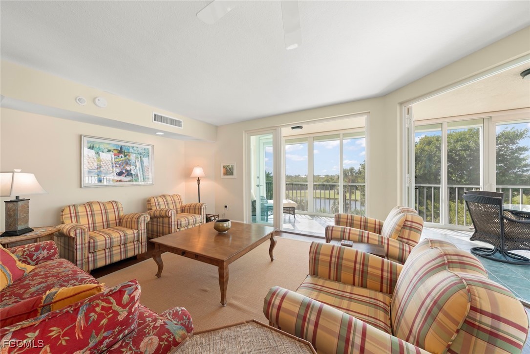 2675 Wulfert Road, Unit 6 Sanibel, FL 33957 - Photo 11 of 47 a living room with furniture and large windows
