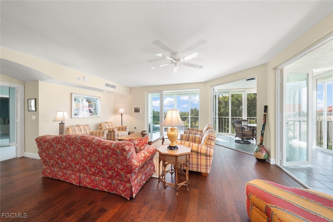 2675 Wulfert Road, Unit 6 Sanibel, FL 33957 - Photo 12 of 47 a living room with furniture and wooden floor
