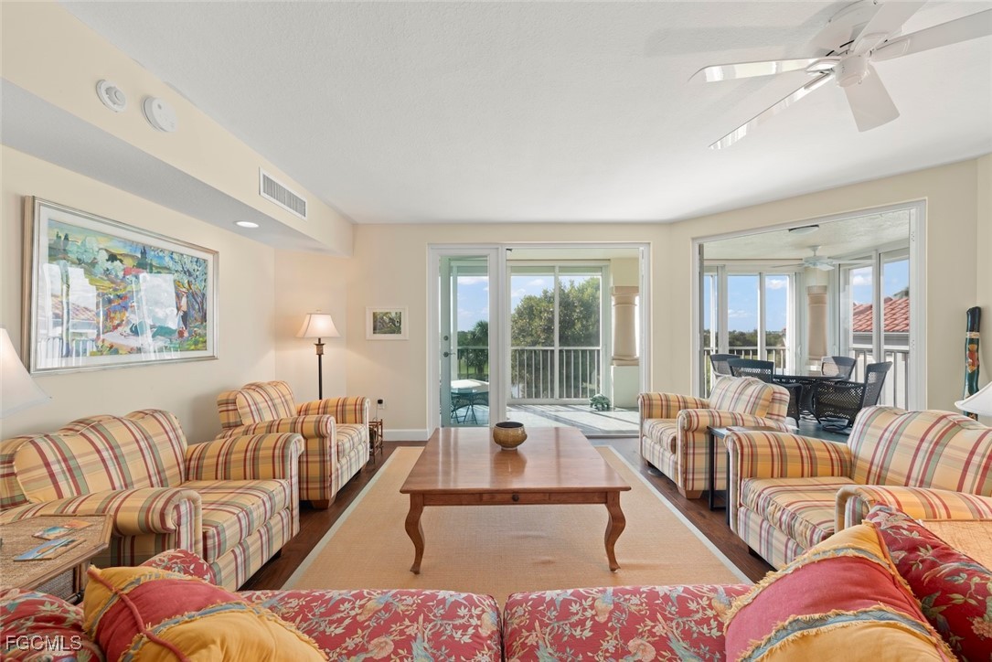 2675 Wulfert Road, Unit 6 Sanibel, FL 33957 - Photo 13 of 47 a living room with furniture or couch and a large window