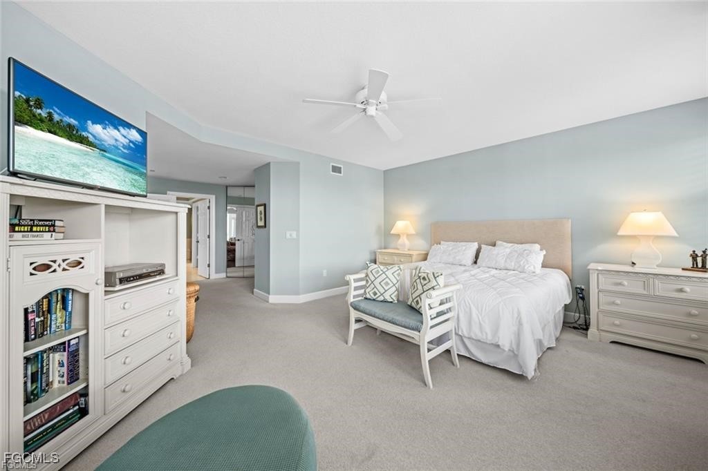 2675 Wulfert Road, Unit 6 Sanibel, FL 33957 - Photo 17 of 47 a bedroom with bed and cabinets