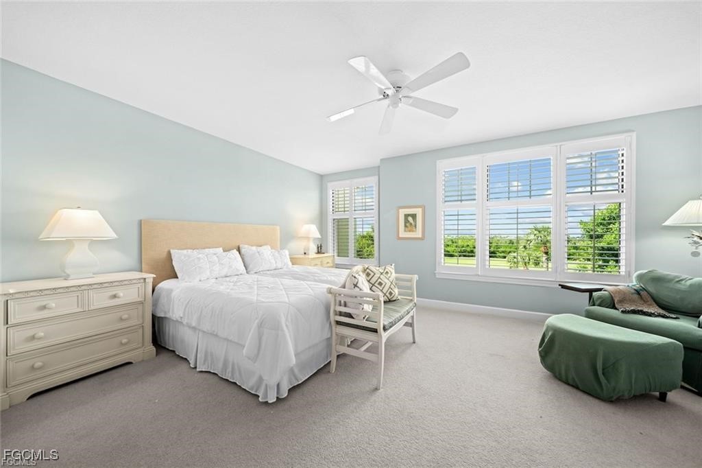 2675 Wulfert Road, Unit 6 Sanibel, FL 33957 - Photo 18 of 47 a bedroom with a bed and a mirror