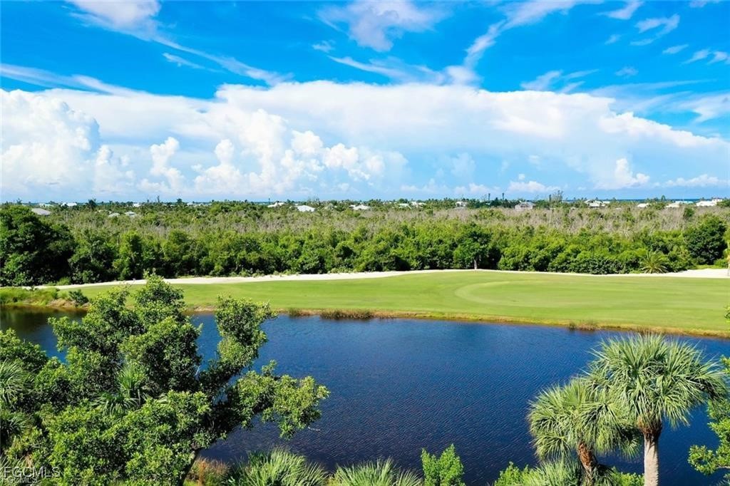 2675 Wulfert Road, Unit 6 Sanibel, FL 33957 - Photo 2 of 47 a view of a yard with a swimming pool