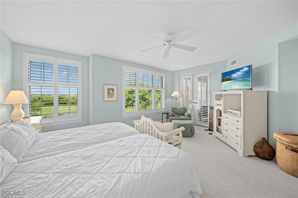 2675 Wulfert Road, Unit 6 Sanibel, FL 33957 - Photo 21 of 47 a bedroom with furniture and a large window