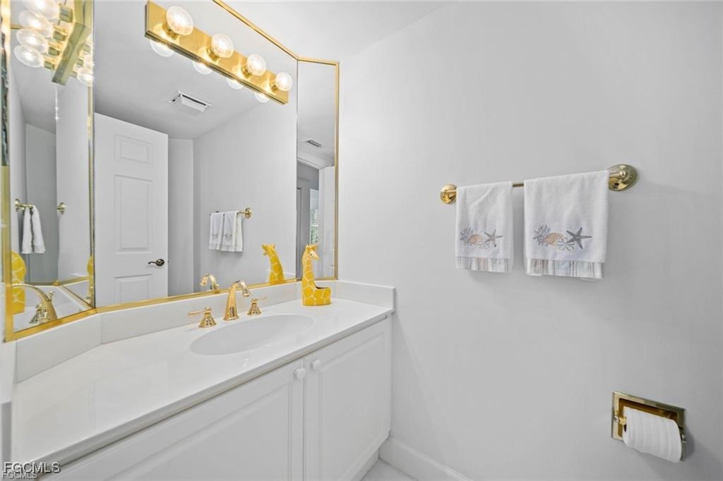 2675 Wulfert Road, Unit 6 Sanibel, FL 33957 - Photo 31 of 47 a bathroom with a sink and a mirror