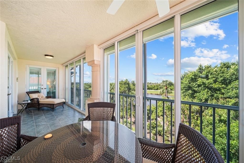 2675 Wulfert Road, Unit 6 Sanibel, FL 33957 - Photo 36 of 47 a living room with furniture and a large window