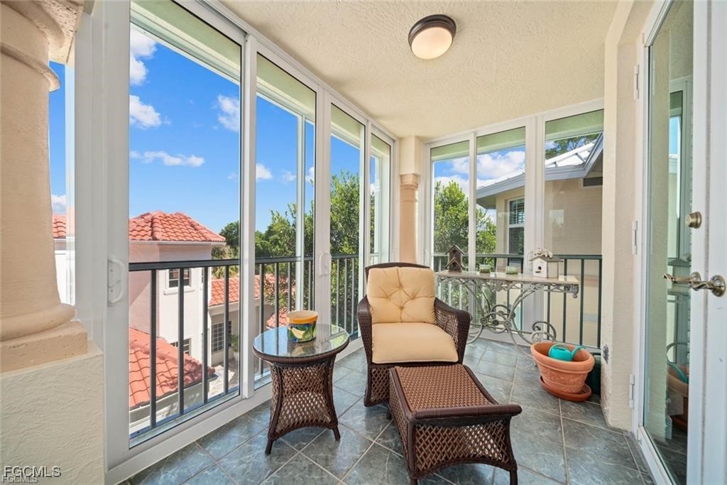 2675 Wulfert Road, Unit 6 Sanibel, FL 33957 - Photo 38 of 47 a living room with furniture and a large window