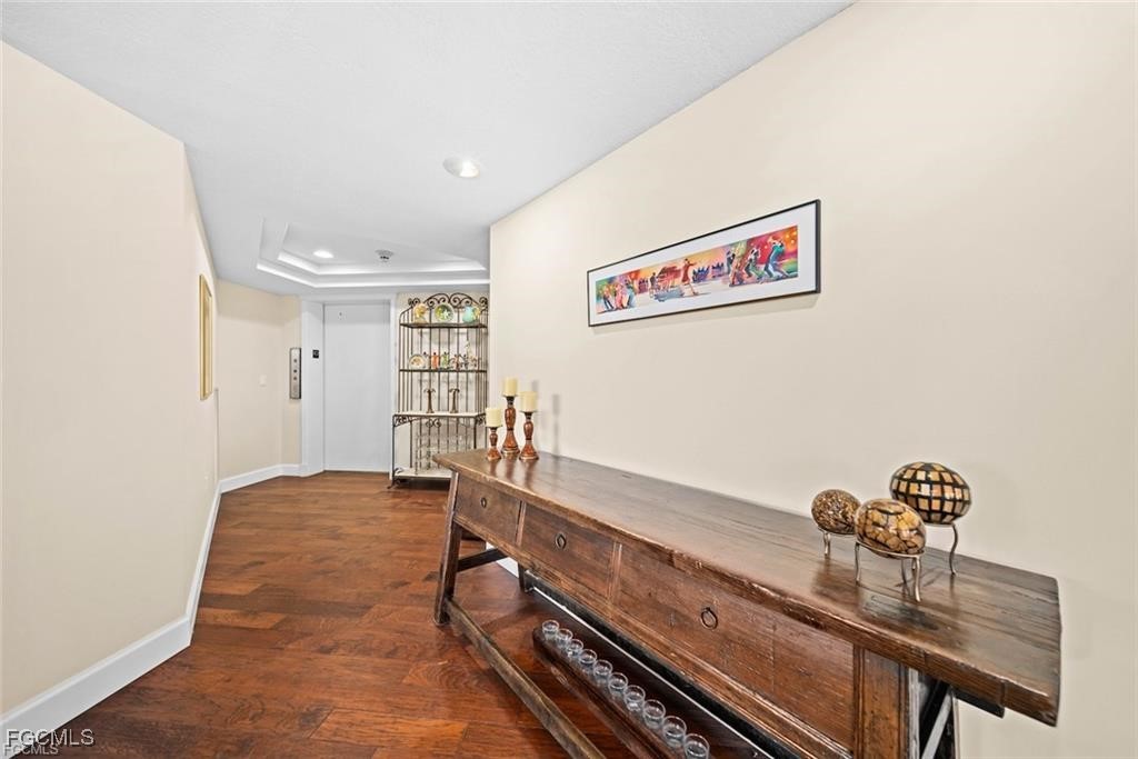 2675 Wulfert Road, Unit 6 Sanibel, FL 33957 - Photo 4 of 47 a hallway with a table and chairs