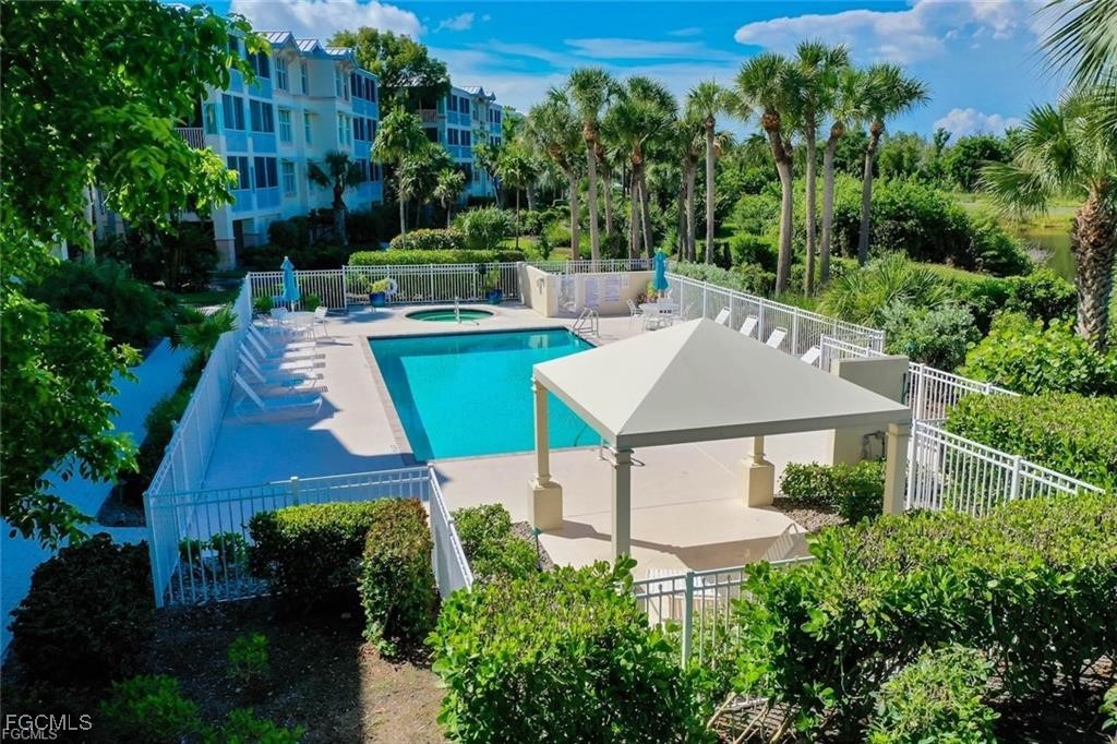2675 Wulfert Road, Unit 6 Sanibel, FL 33957 - Photo 43 of 47 an aerial view of a house with a yard basket ball court and outdoor seating