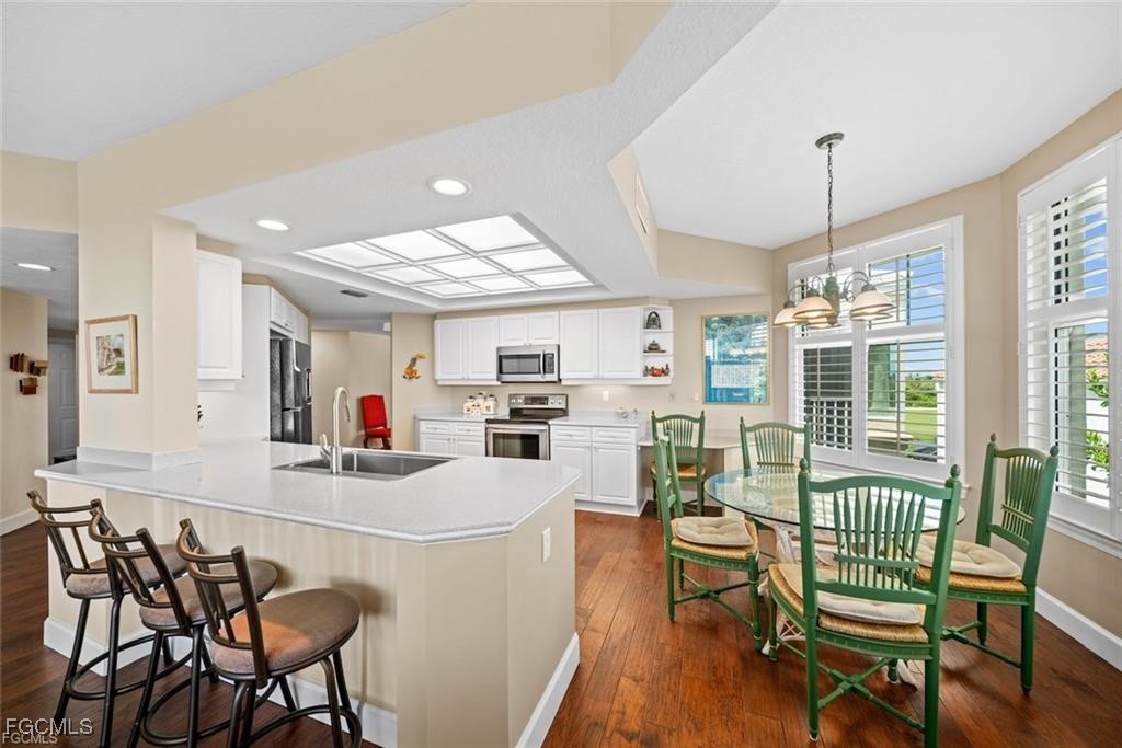 2675 Wulfert Road, Unit 6 Sanibel, FL 33957 - Photo 8 of 47 a dining room with furniture and window