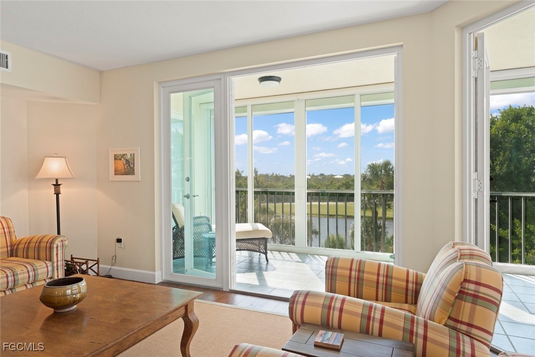 2675 Wulfert Road, Unit 6 Sanibel, FL 33957 - Photo 10 of 47 a living room with furniture and a large window