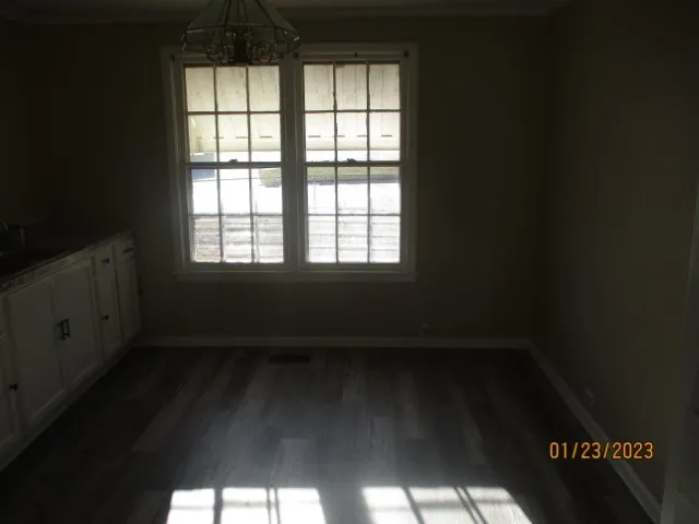 a view of an empty room and window