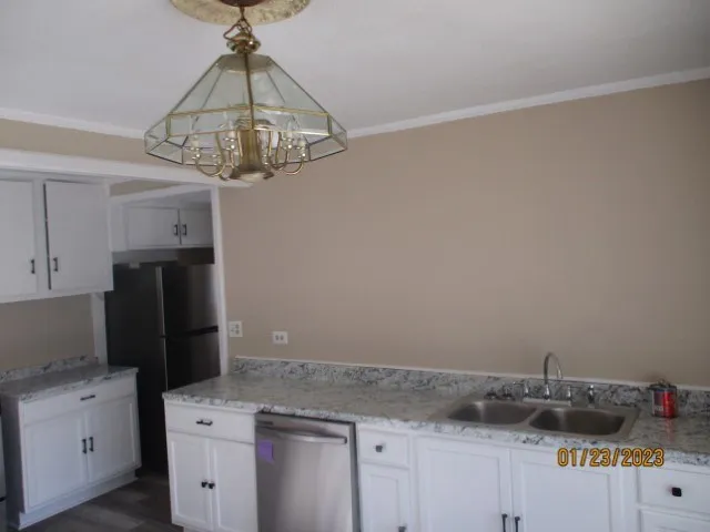 a kitchen with a sink and cabinets