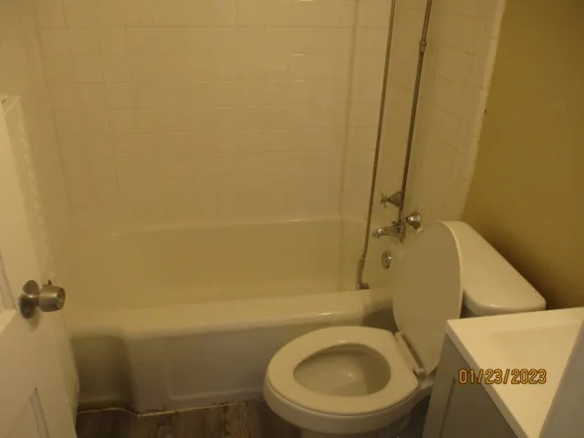 a bathroom with a toilet and a sink