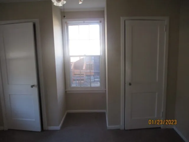 a view of an empty room and window