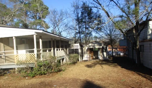 a view of a large building with large trees