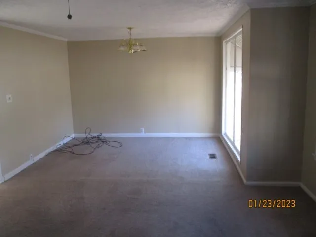 an empty room with a empty space and window