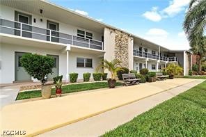 708 Victoria Drive, Unit 206 Cape Coral, FL 33904 - Photo 2 of 17 a front view of a building with street view