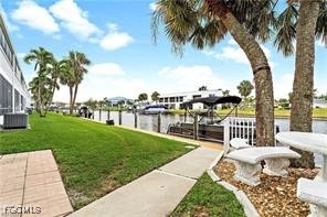 708 Victoria Drive, Unit 206 Cape Coral, FL 33904 - Photo 4 of 17 a view of a garden with a lake
