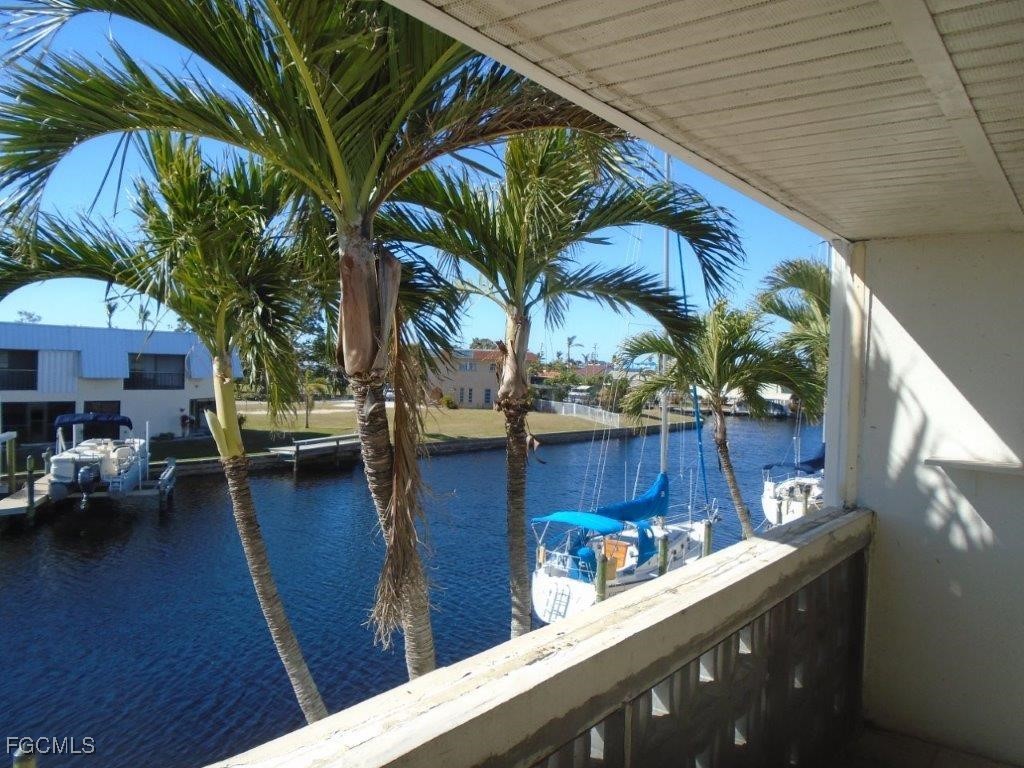 708 Victoria Drive, Unit 206 Cape Coral, FL 33904 - Photo 6 of 17 a view of a backyard with swimming pool