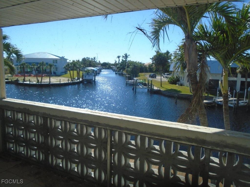 708 Victoria Drive, Unit 206 Cape Coral, FL 33904 - Photo 7 of 17 a view of swimming pool with outdoor seating