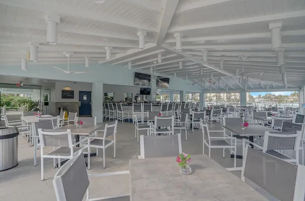 a view of a chairs and tables in the patio