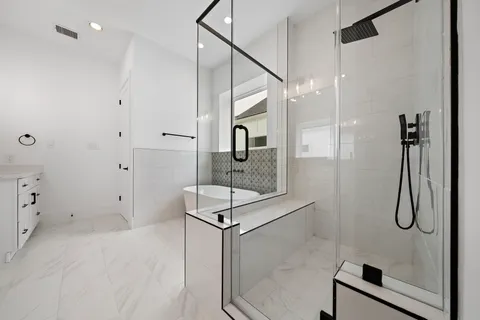 a white bath tub sitting in a bathroom