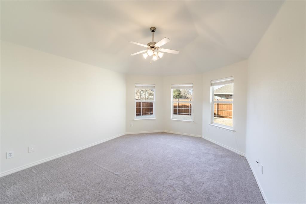 1627 Balboa Lane Allen, TX 75002 - Photo 12 of 23 an empty room with windows and ceiling fan