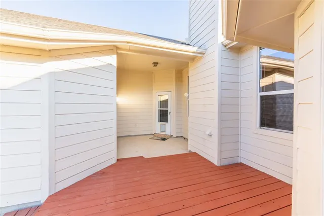 a view of front door and wooden floor