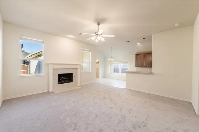 a view of a kitchen with a sink and a fireplace