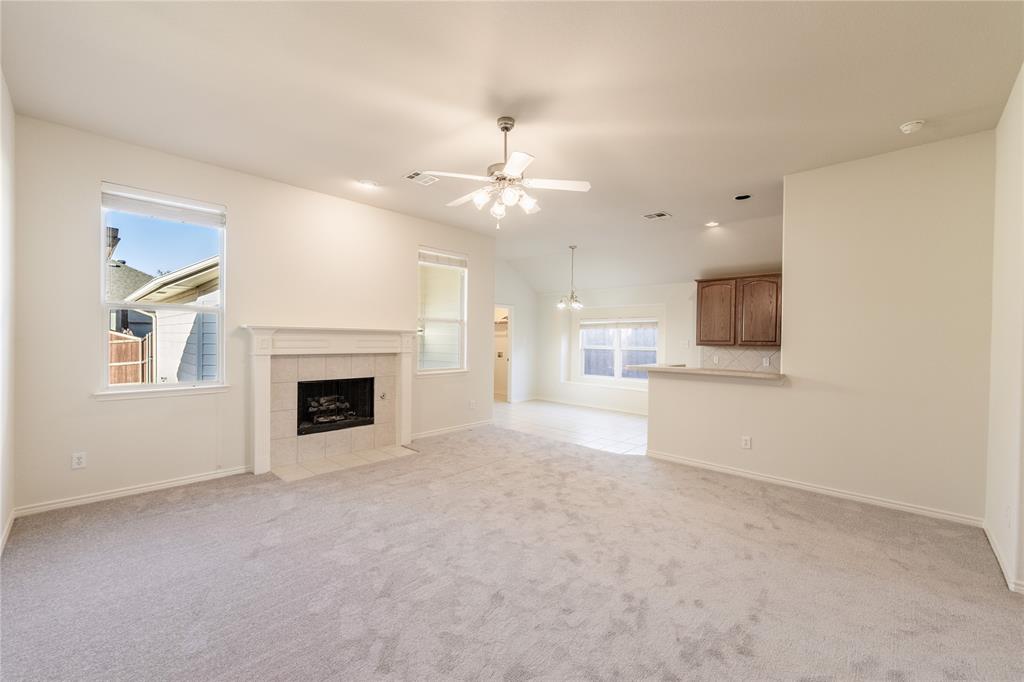 1627 Balboa Lane Allen, TX 75002 - Photo 5 of 23 a view of a kitchen with a sink and a fireplace