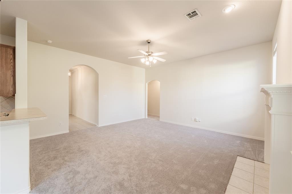 1627 Balboa Lane Allen, TX 75002 - Photo 7 of 23 a view of a kitchen with a sink and a chandelier fan