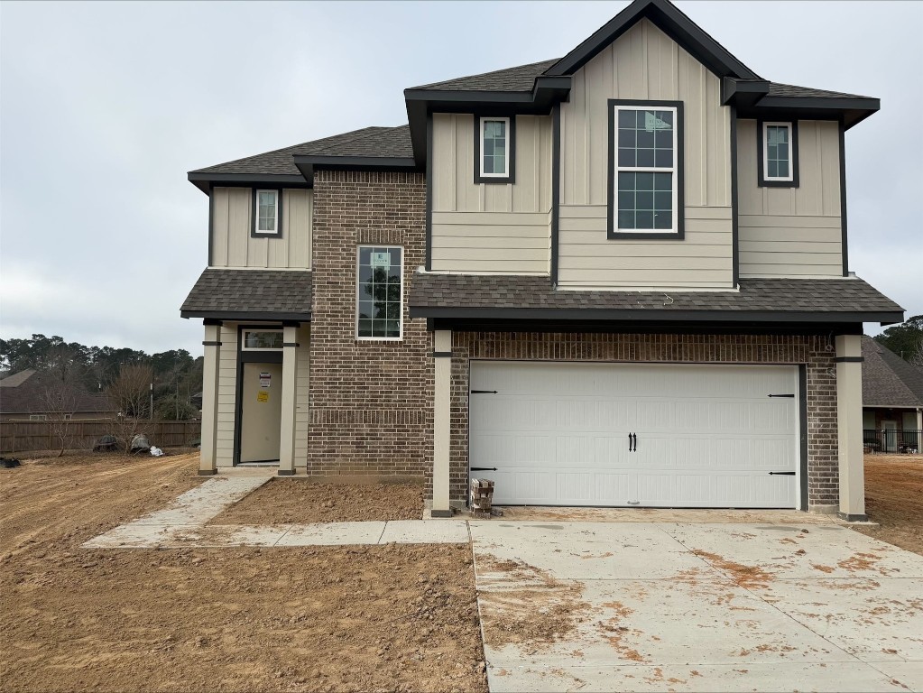 a front view of a house with parking space