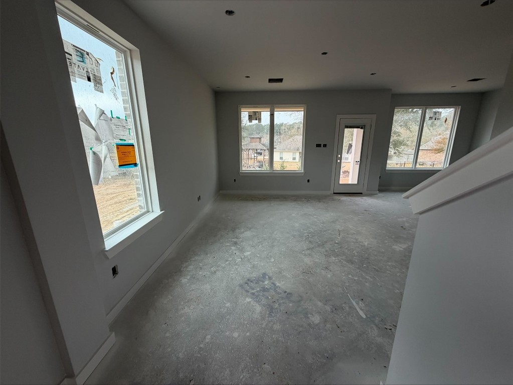 3714 Violet Lane Huntsville, TX 77340 - Photo 2 of 18 a view of an empty room with windows