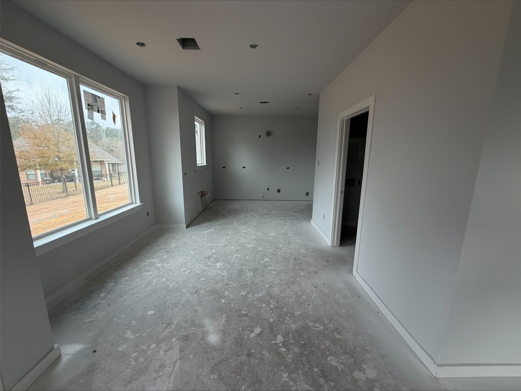 3714 Violet Lane Huntsville, TX 77340 - Photo 4 of 18 a view of empty room with windows