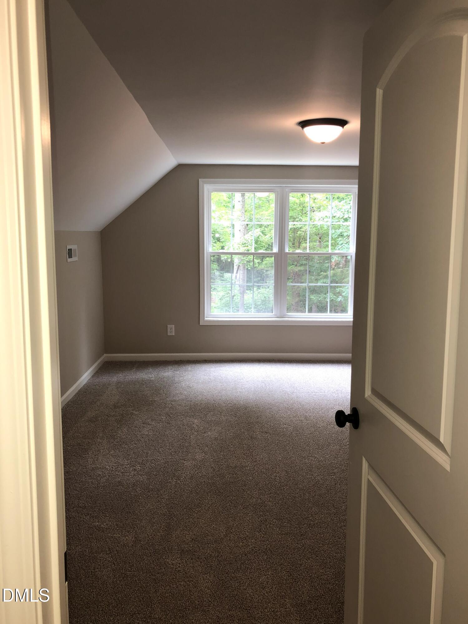 95 Smith Taylor Trail Roxboro, NC 27574 - Photo 39 of 47 a view of empty room with floor to ceiling window