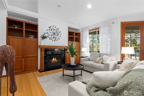 a living room with furniture a window and a fireplace