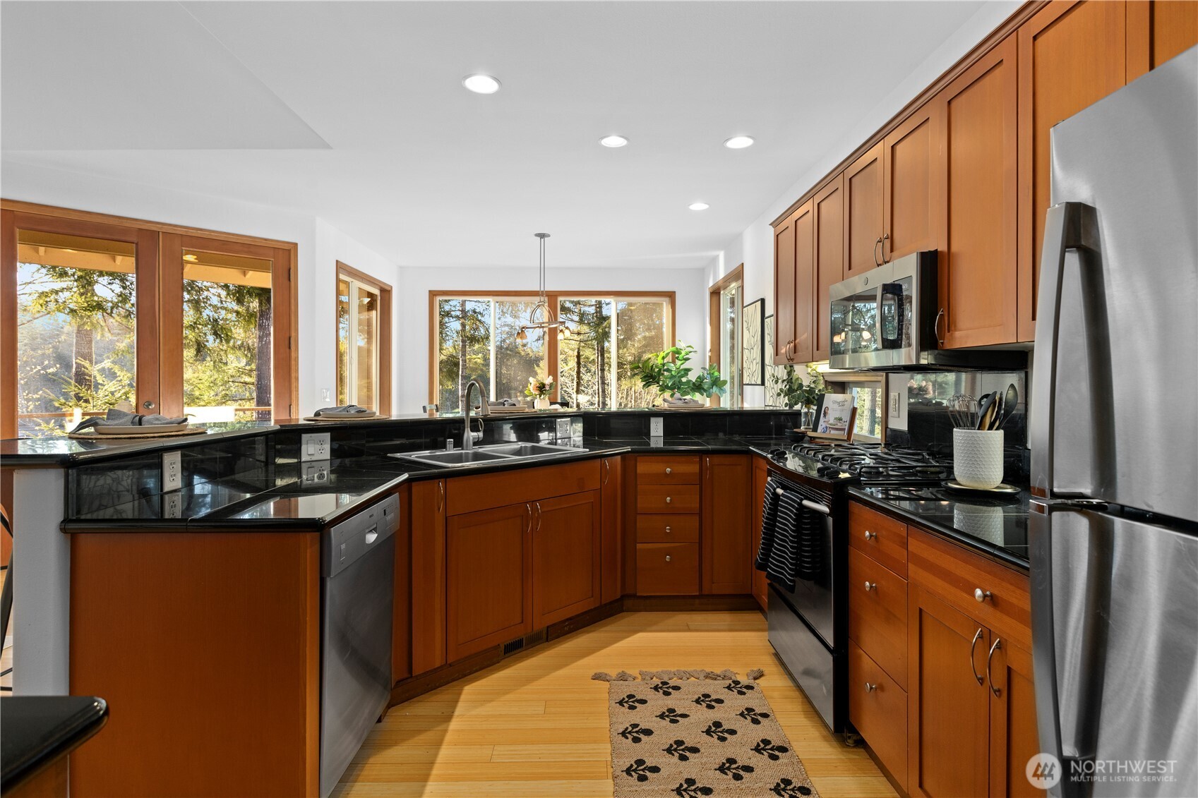 730 Southeast Nelson Road Shelton, WA 98584 - Photo 15 of 40 a kitchen with stainless steel appliances granite countertop a sink stove and refrigerator
