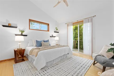 a bedroom with a bed and a couch