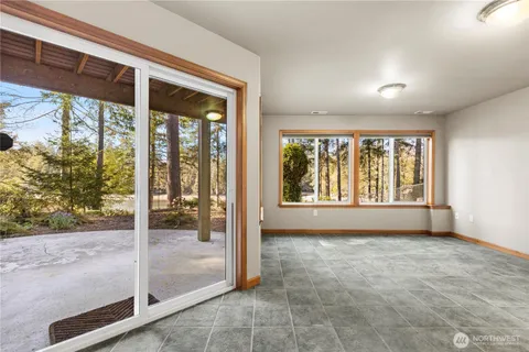 a view of an empty room and glass door